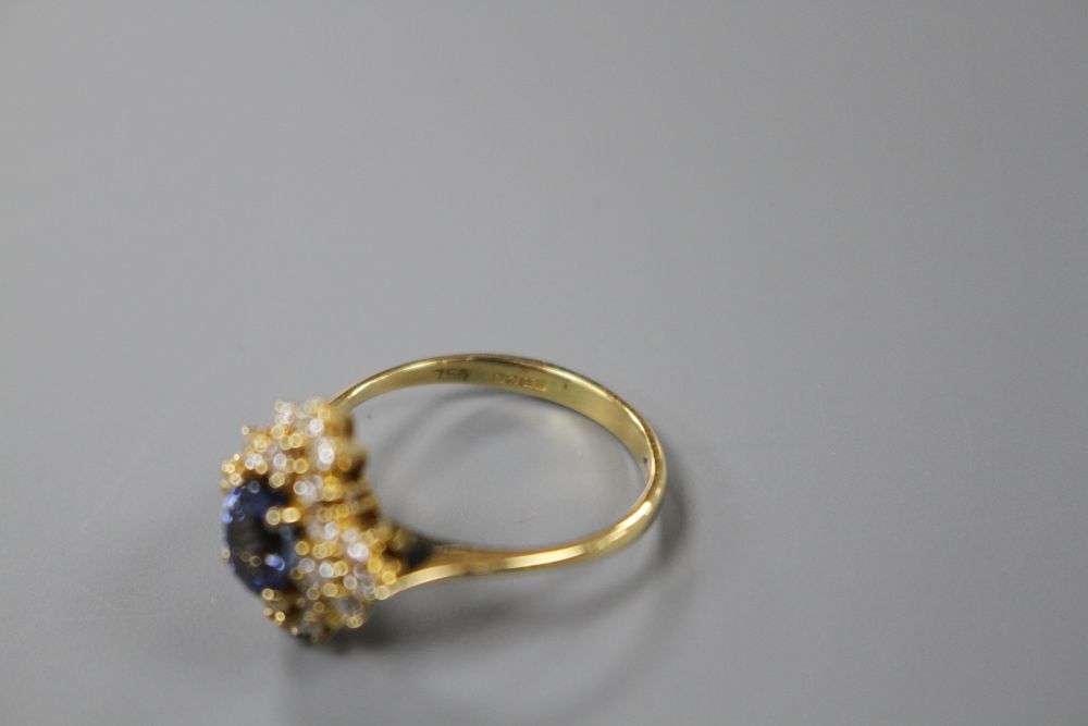 A modern 18ct gold, sapphire and diamonds set quatrefoil shaped cluster ring, size M, gross 4 grams